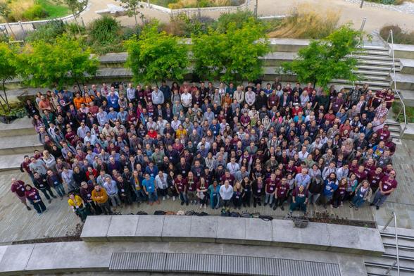 A group shot of around 400 attendees at RSECon24 in Newcastle, all smiling up at the camera.