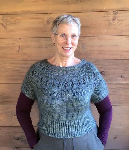 Me in my knitted 'Ranunculus' pattern cropped short sleeved sweater, with a lace patterned yoke. In a blue-green teal color, with some fuzzy mohair texture.
