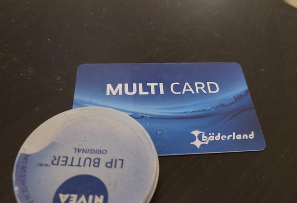 Photo of a blue swimming pool member card with "Multi Card" written on the front.