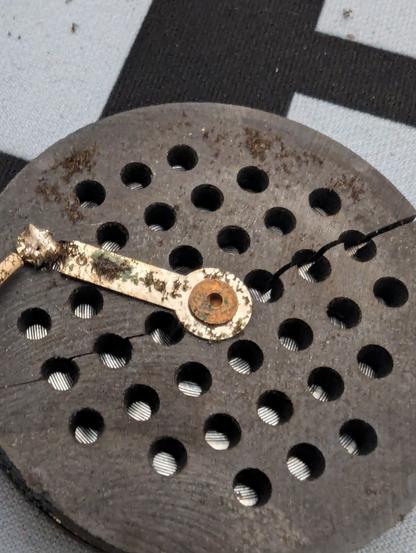 Reverse side of the ortholinear HP-2 driver with a large crack running down the entire diameter of the driver.