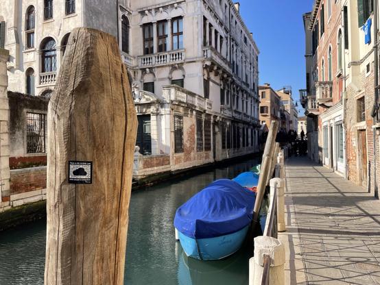 The FSFE’s sticker “There’s no cloud, just someone else’s computer” stuck on a wooden boat-parking pole, in a Venetian canal.