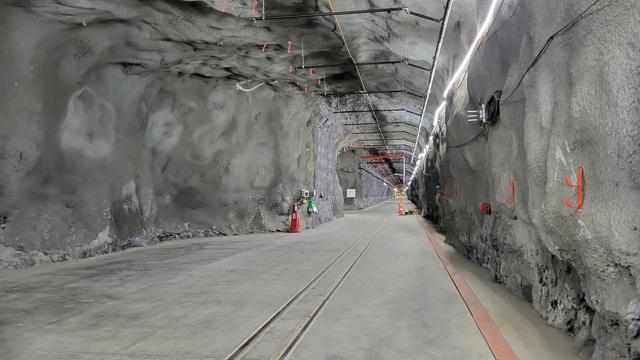 We walk down the main corridor that connects to the DUNE caverns.