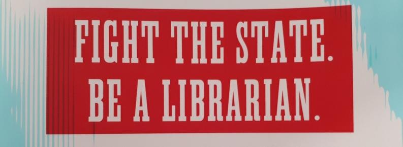 In big, bold white letters on a vibrant red background, it says: Fight the state. Be a librarian.