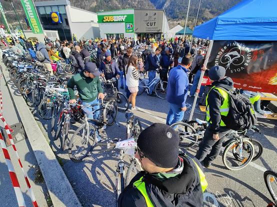 A used bike market with 200 or more used bikes, crowded with lots of people looking for a match.