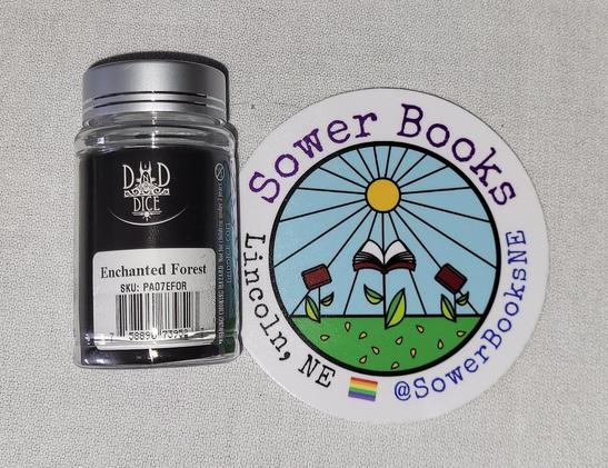 Sticker for Sower Books and a Jar of DnD Dice.