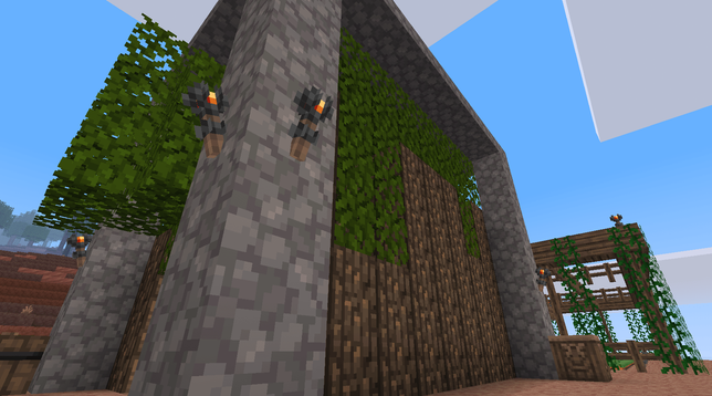 Mineclonia.  A low shot of a basic tree farm in the foreground, with a covered (oak fences and vines) farm in the background.
