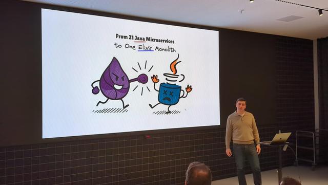 Igor Spiridonov presenting about his team's journey from 21 Java Microservices to one Elixir Monolith