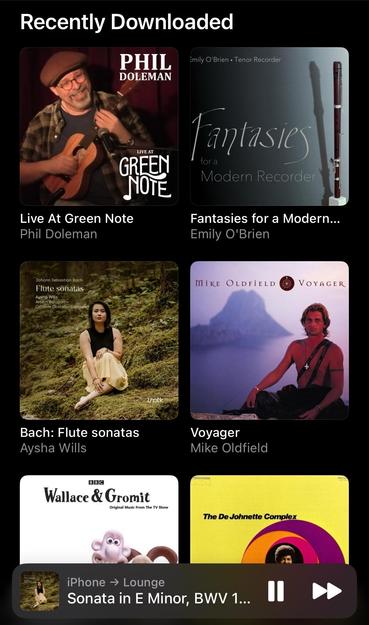 Screenshot of music player library showing recent downloads arranged in a grid of album covers. They include "Live at Green Note" by Phil Doleman; "Fantasy for a Modern Recorder" by Emily O'Brien; and "Johann Sebastian Bach Flute Sonatas" by Aysha Wills. There's also a Wallace & Gromit EP and a Mike Oldfield album where he's sitting on a rock with his shirt off for some reason. Anyway, "Sonata in E minor, BWV 1034: IV. Allegro" is playing, and jolly nice it is too.