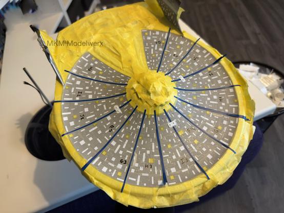 Bottom of the saucer section with grey, blue and yellow masks applied to cover most of it.