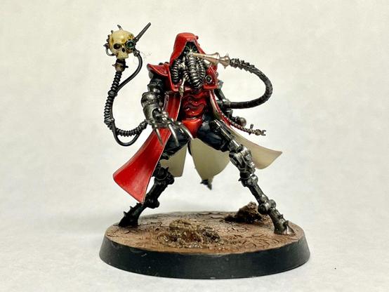 a 40k caped tentacle robot with tubes and pointy bits everywhere