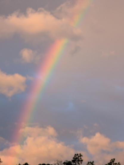 Rainbow through clouds