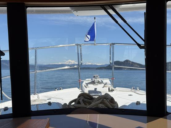 View through the windscreen of a boat with snow covered Mount Baker off of the distance.

This photo copyright 2025 by Maria Langer. All rights reserved. Neither this image nor the accompanying alt text may be used to train AI systems.