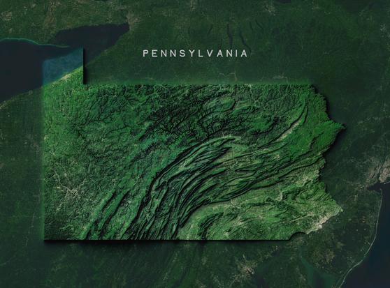 Satellite topographical map of Pennsylvania. The state outline is highlighted against a dark green background. The image shows Pennsylvania's predominantly forested landscape in various shades of green. The Appalachian Mountains are visible as diagonal ridges running southwest to northeast across the state's central portion, creating a distinctive folded or wrinkled pattern in the terrain. Lake Erie appears as a dark blue area in the northwest corner. Urban areas appear as lighter patches scattered throughout the state. The relief detail highlights the state's significant topographical features that influenced its settlement patterns and economic development.