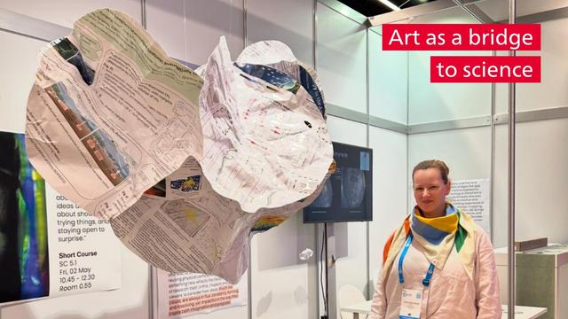 Liliane Burkhard next to her floating sculpture at the EGU General Assembly
