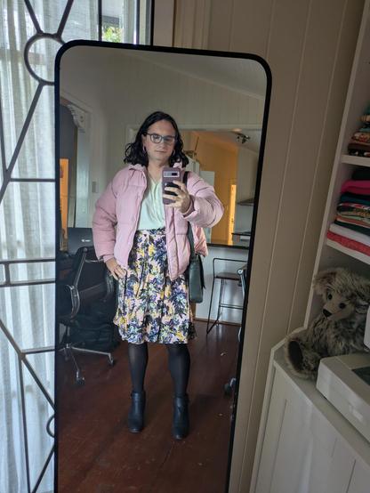 Mirror selfie of me wearing the outfit in the flat lay.