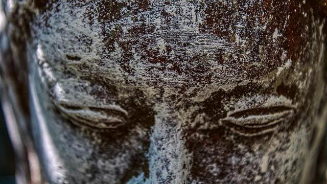 Face of stone Buddha.