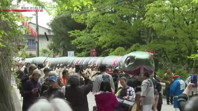 Giant snake-shaped portable shrine parades through Japanese hot spring resort