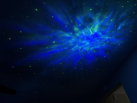 Laser projecting nebula and stars on the ceiling.