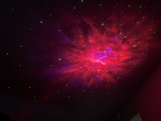 Laser projecting nebula and stars on the ceiling.
