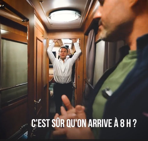 Macron in the fancy Ukrainian night train, hanging off the wooden door frame like the huge diva he is, asking the train attendant in French if they're sure the traing is going to arrive in Kyiv at 8am.