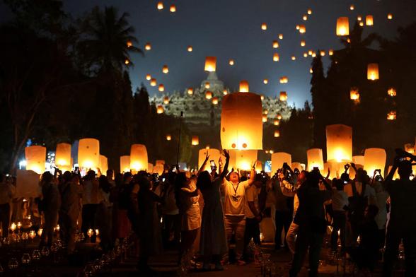 People release paper lanterns during a ceremony on Vesak Day, an annual celebration of the Buddha's birth, enlightenment, and passing, at Borobudur temple.