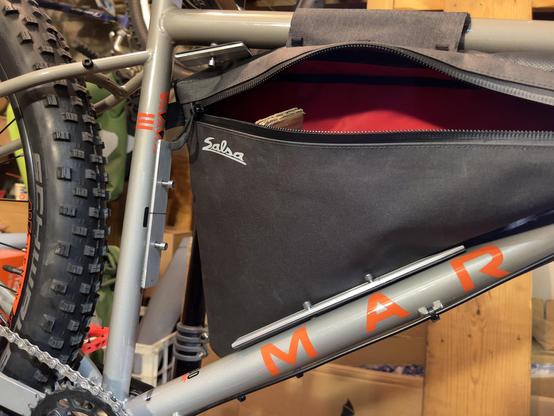 Photo of test fitting of aluminum bar interior mounts for Salsa frame pack on eMtb Marin Pine Mtn build