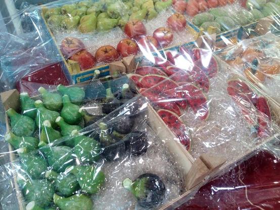 Boxes of marzipan fruit candy, sealed in plastic wrap.