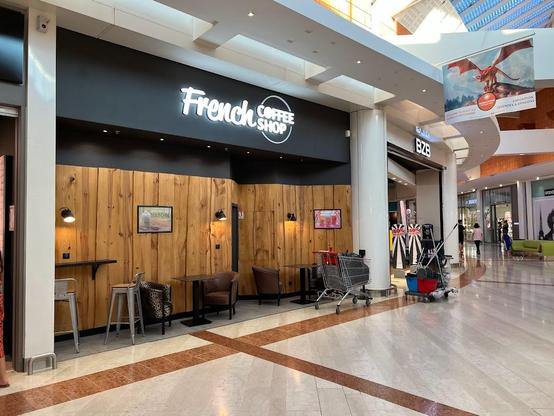 A "French Coffee Shop" cafe in a mall.