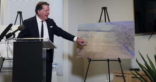 Attorney Dan Cogdell points to the land purchased by Community Capital Partners during a press conference Thursday, April 3, 2025, in Dallas. The land is intended for a 402-acre proposed development by East Plano Islamic Center.