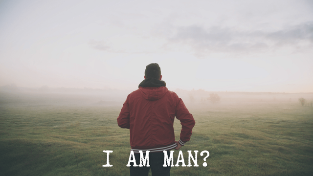 A stock photo of a man from behind looking out over a misty landscape. The title I am man? is written across the bottom in white