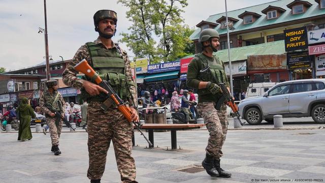 Indian paramilitary soldiers patrol a busy market in Srinagar, in India-controlled Kashmir.