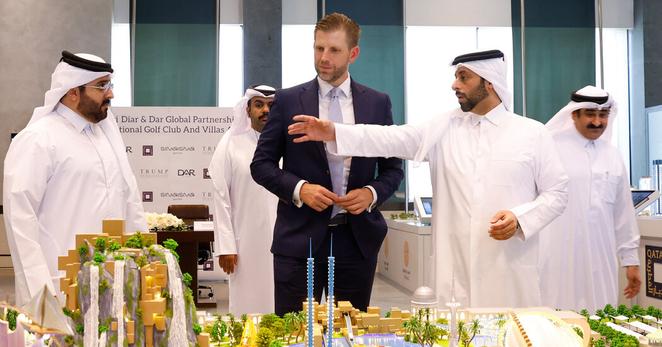 Eric Trump in Doha, the Qatari capital, on Wednesday, looking over a model of a development the Trump Organization plans to build there.