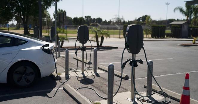 FILE - Electric vehicle chargers are seen in the parking lot of South El Monte High School in South El Monte, Calif., Aug. 26, 2022. (AP Photo/Jae C. Hong, File)