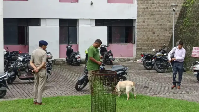 Police Dog Squad with Bomb Detection team inspecting Court complex for bomb.