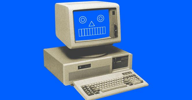 A desktop computer with a digitally illustrated face on the screen.