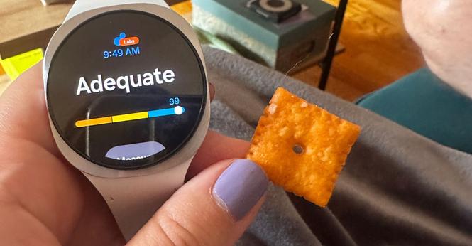The Samsung Galaxy Watch 8 with a Cheez-it showing a score of 99 and Adequate.