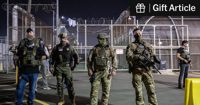 Federal agents outside an ICE detention facility in Newark last month.