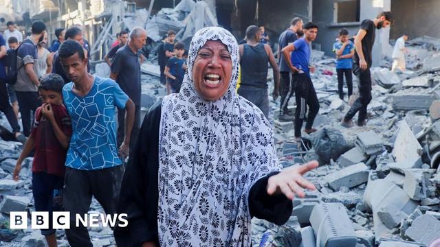 A woman reacts following an overnight Israeli air strike on a house in Gaza City, northern Gaza (16 September 2025)