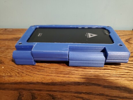 Back closed view of the folding dual pinephone case showing the big chunky hinge