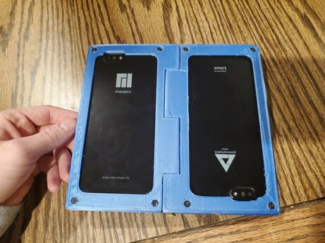 Open flat back of the folding dual pinephone case