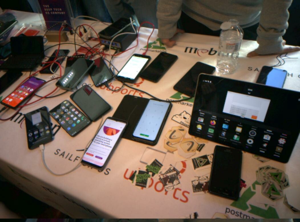 A table full of mobile Linux phones