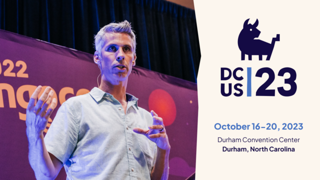 A man speaker at DjangoCon US 2022 next to an infographic showing basic details about DCUS 23