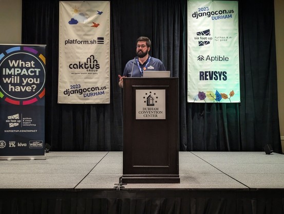 Josh on the stage of DjangoCon US 2023