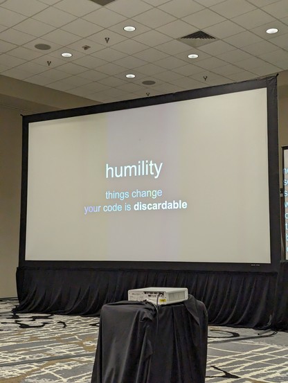 A slide titled humility. "things change. Your code is discardable"