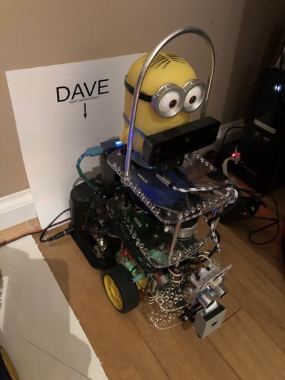 ROS 2 robot Humble Dave sitting on recharge dock.

Humble Dave has a minion Dave character atop the four layers of a Go Pi Go 3 robot.