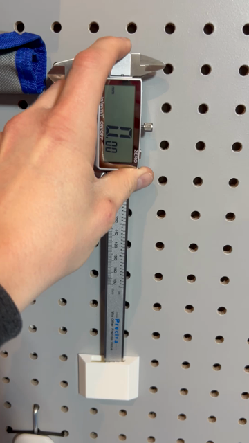 A video of calipers on a pegboard.