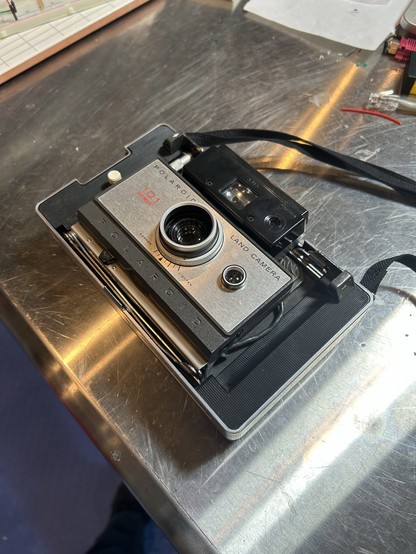 Polaroid 101, case removed, folded up.