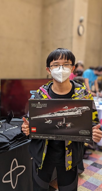 A boy holding a Star Wars Lego set
Temporal Booth with its logo