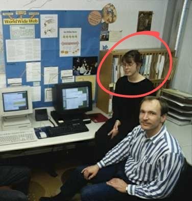 A photo of the CERN office with a poster about the World Wide Web, with a couple of desktop computeas and Tim Berners Lee and Nicola Pellow in the foreground. Source: https://cds.cern.ch/record/1164401