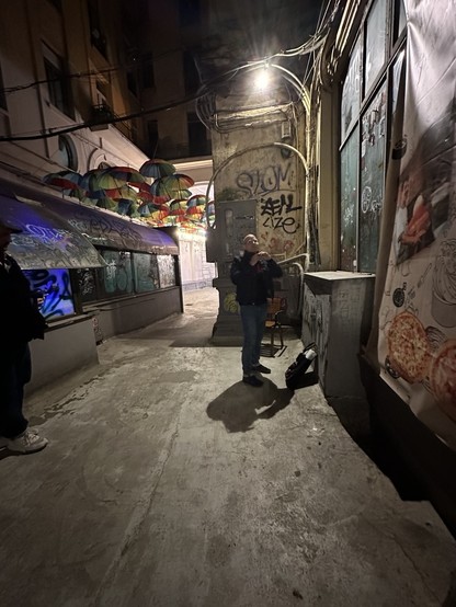Walking the streets of Bucharest with several street artists this weekend… here, we’re in a well-lit alley preparing to paste up some art